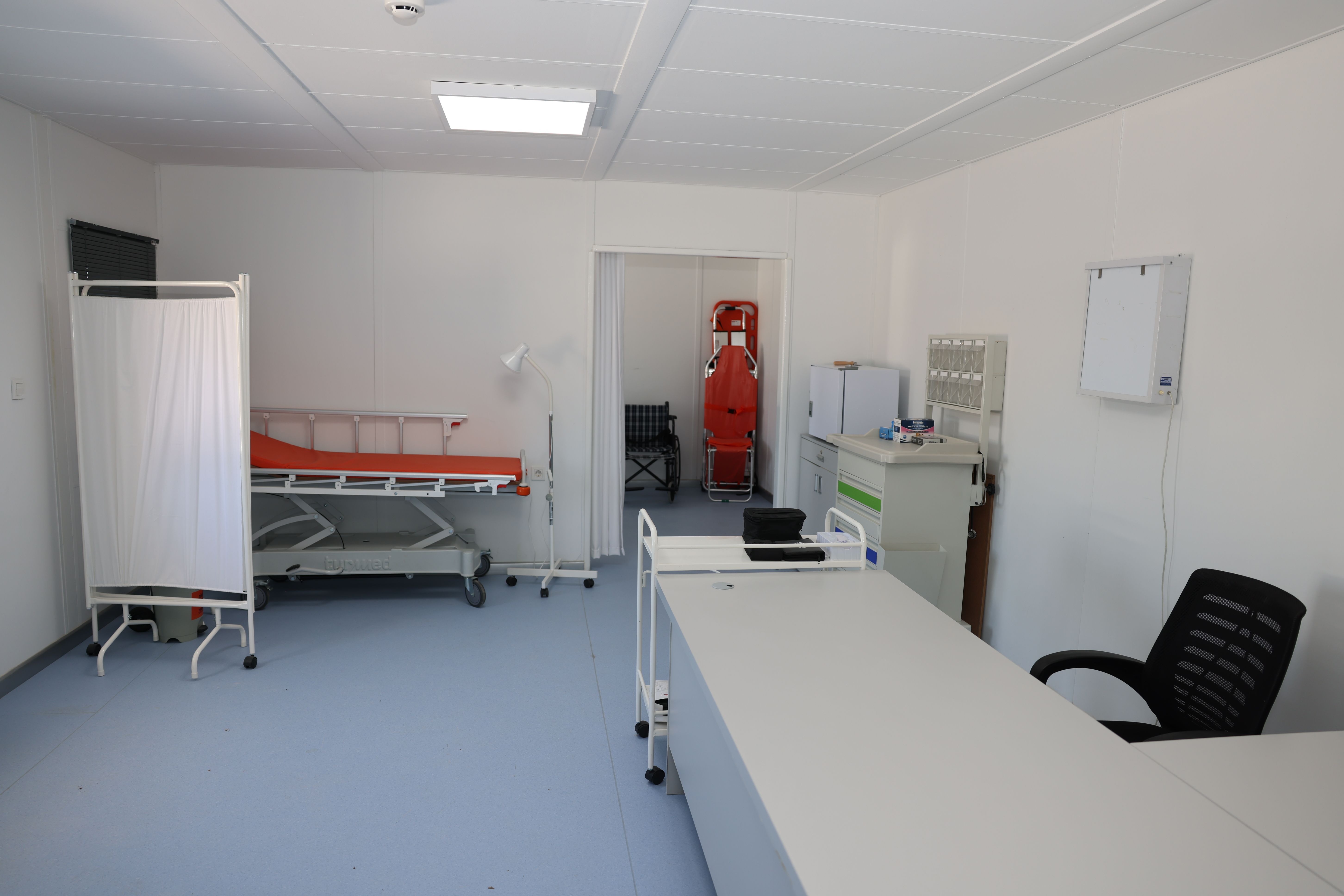 Girl with protective glasses in laboratory